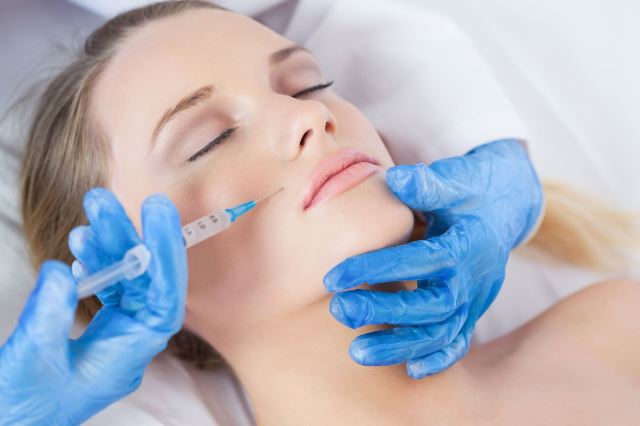 Woman getting a facial injection PRP