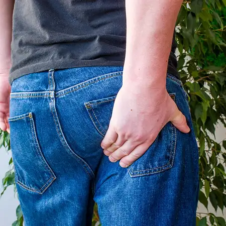 Sharp, shooting pain down one or both legs